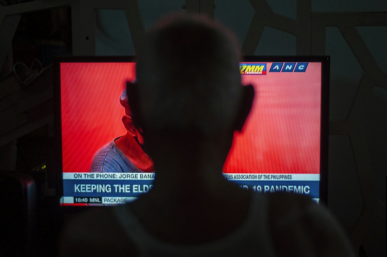 Person watching results on television